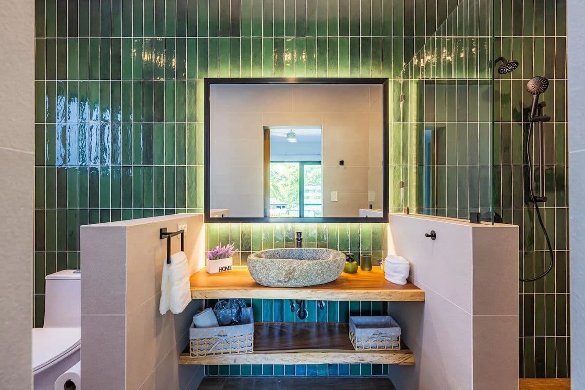 Villa bathroom with green tile