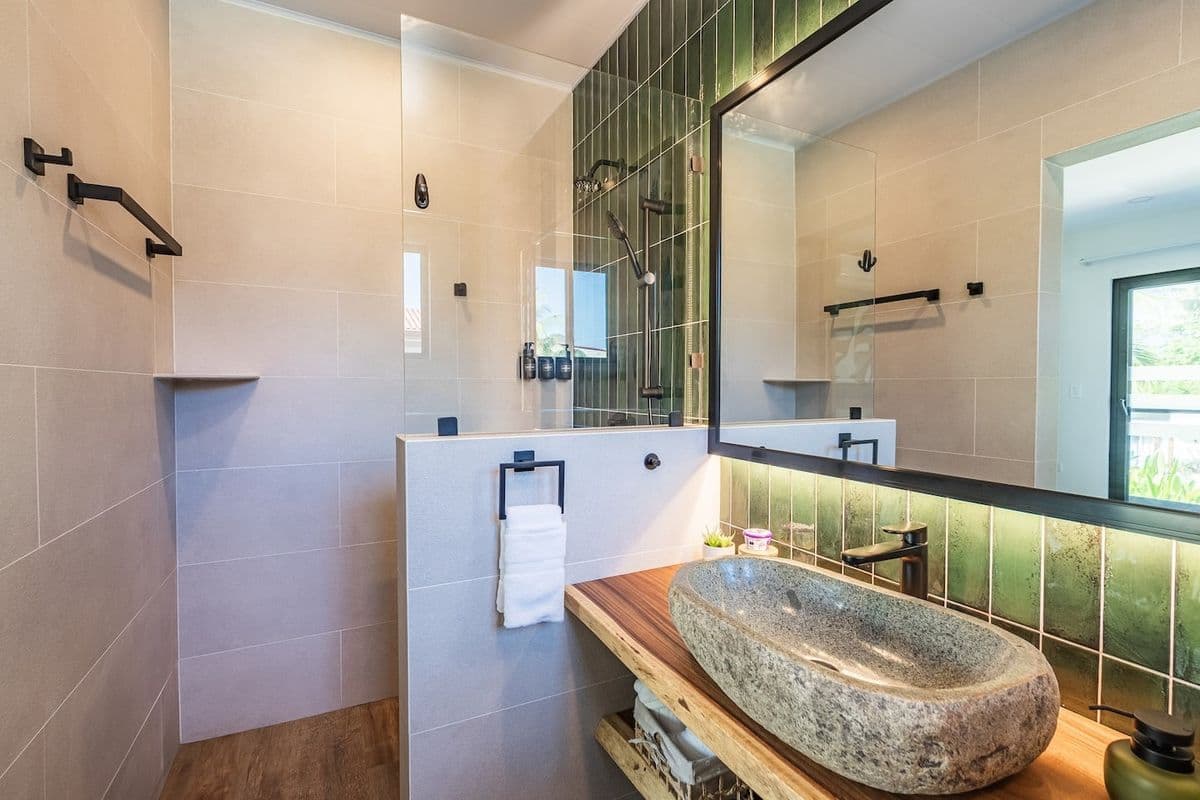 Modern villa bathroom with stone vessel sink