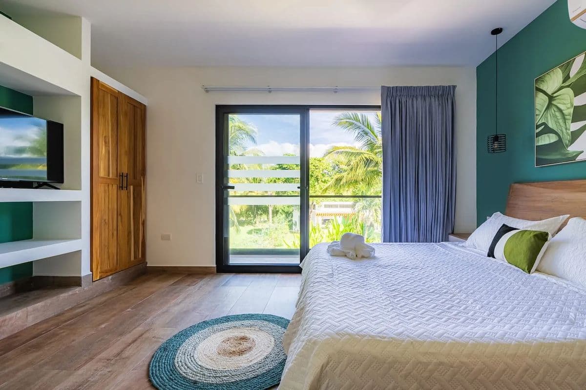 Villa bedroom opening to garden