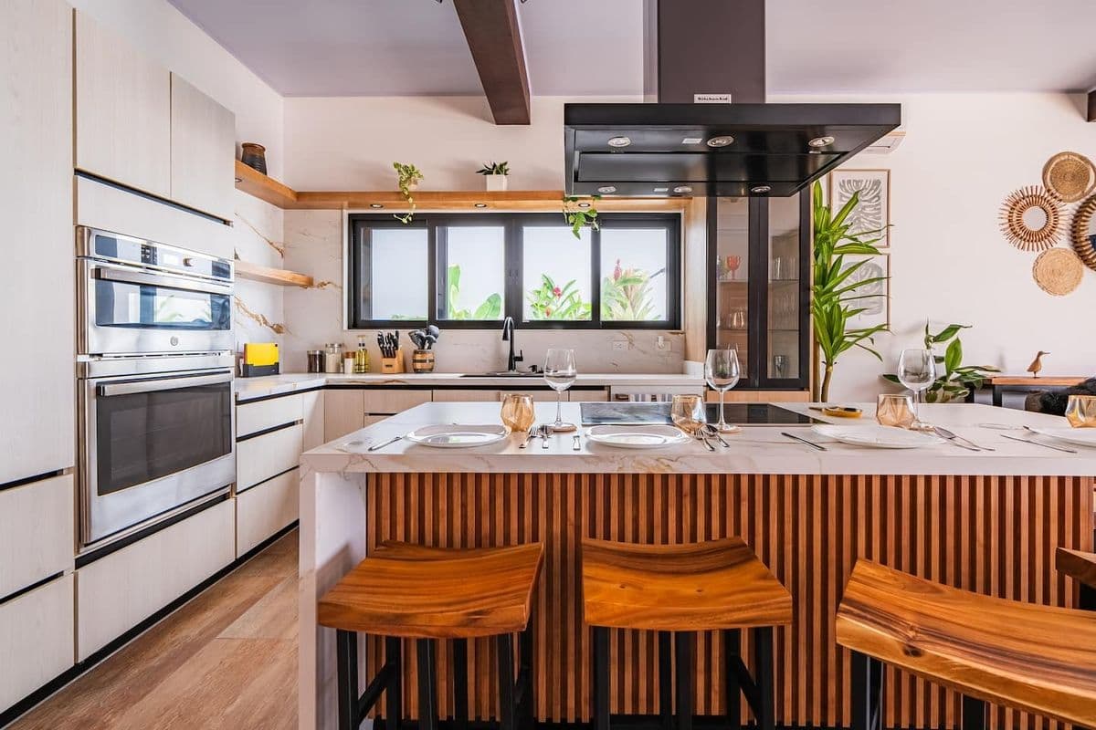 Elegant villa kitchen with marble island
